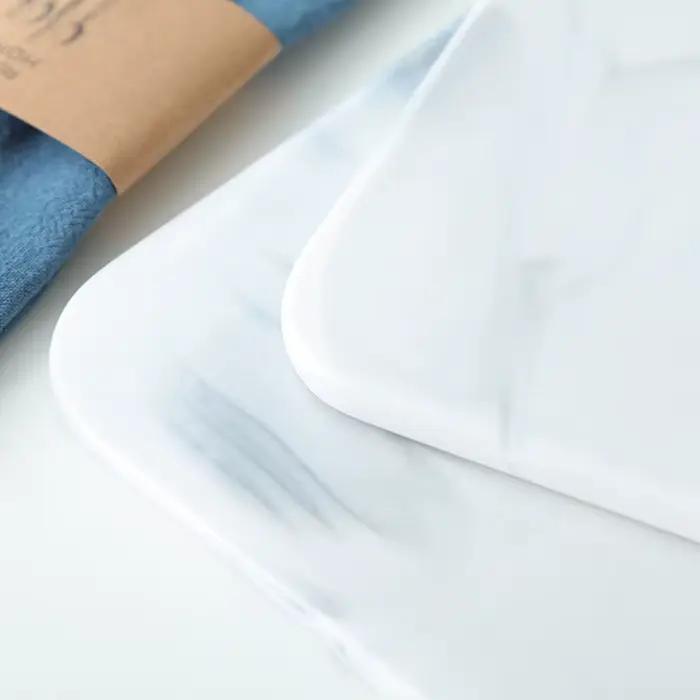Planche à découper en marbre pour craquelins au fromage et sushi