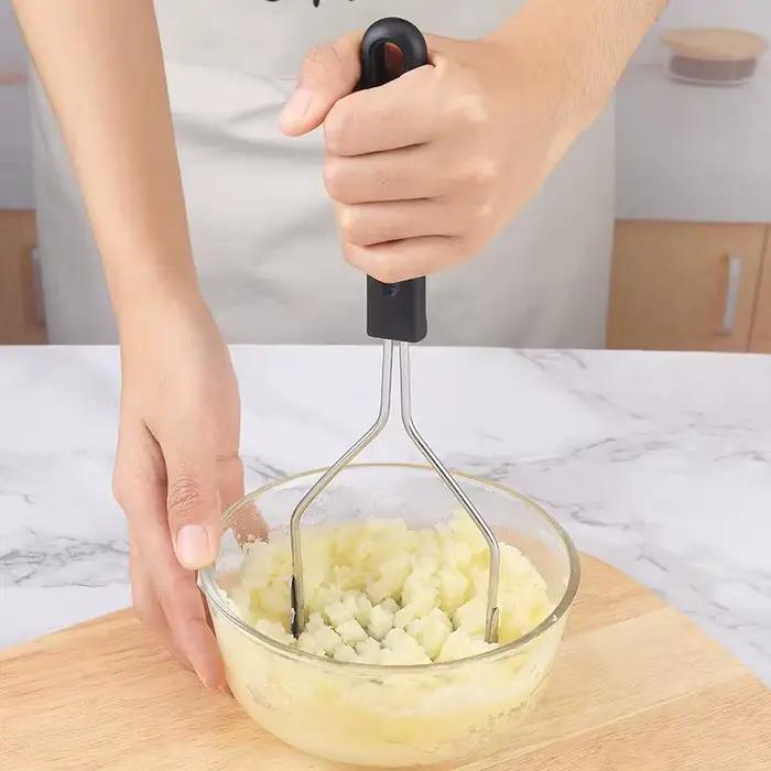 Poussoir de pommes de terre en acier inoxydable