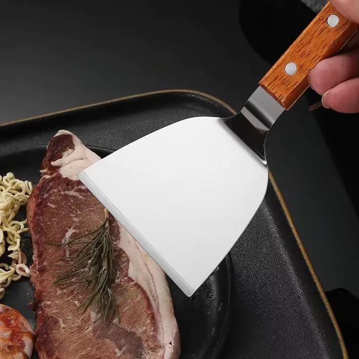 Spatule de cuisson avec manche en bois en acier inoxydable