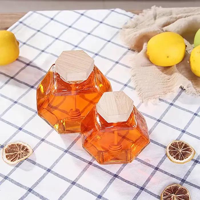Bouteille de miel en verre hexagonale avec pot en bois