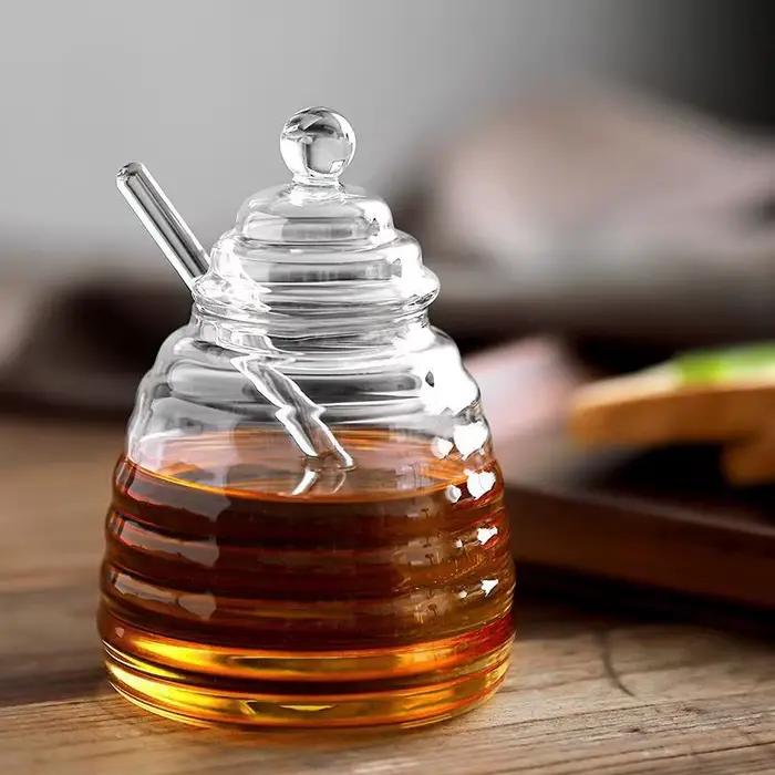 Récipient de stockage de miel précieux en accent d'abeille en verre avec louche et couvercle