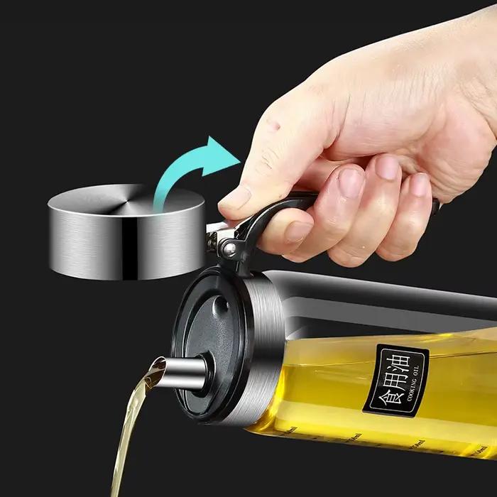 Bouteille d'huile en verre avec couvercle rabattable
