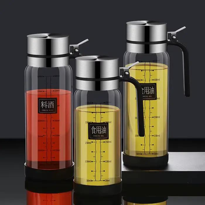 Bouteille d'huile en verre avec couvercle rabattable