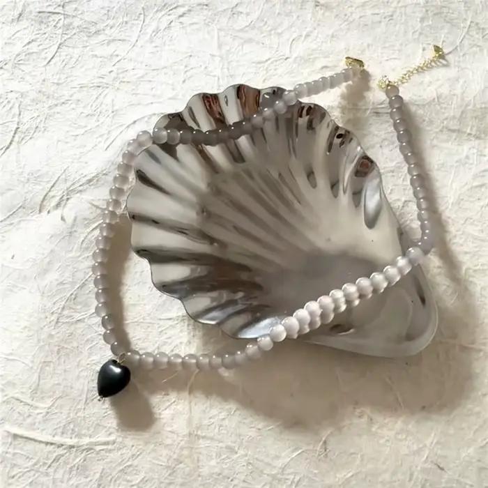 Assiette en acier inoxydable en forme de coquille