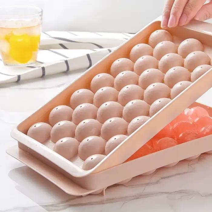 Moule à glaçons 66/33 - Moule à glaçons ronds pour whisky et cocktails avec couvercle, forme de balle de hockey parfaite, sans BPA, mini-bac, outil de cuisine