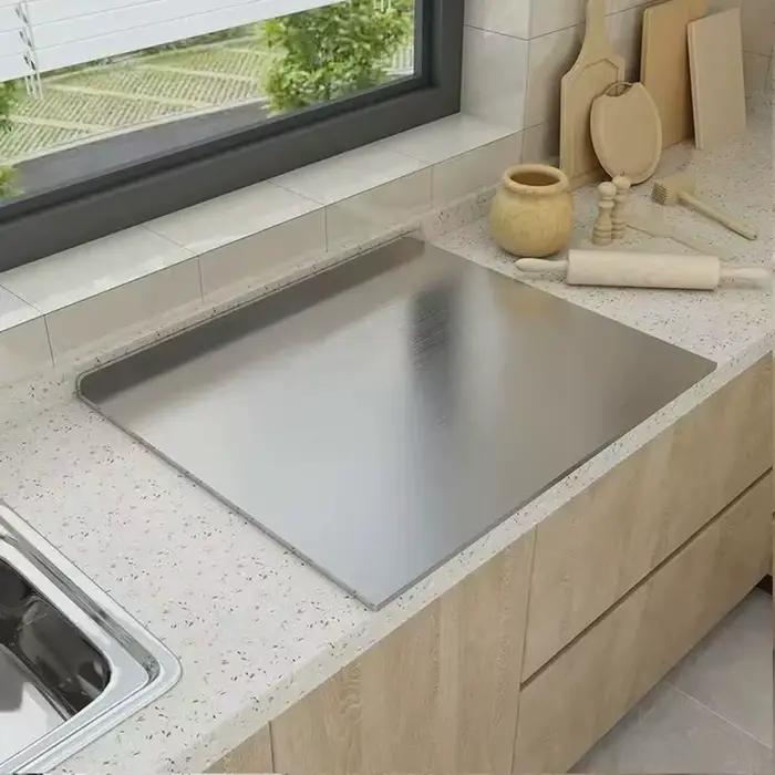 Planche à découper en forme de L en acier inoxydable