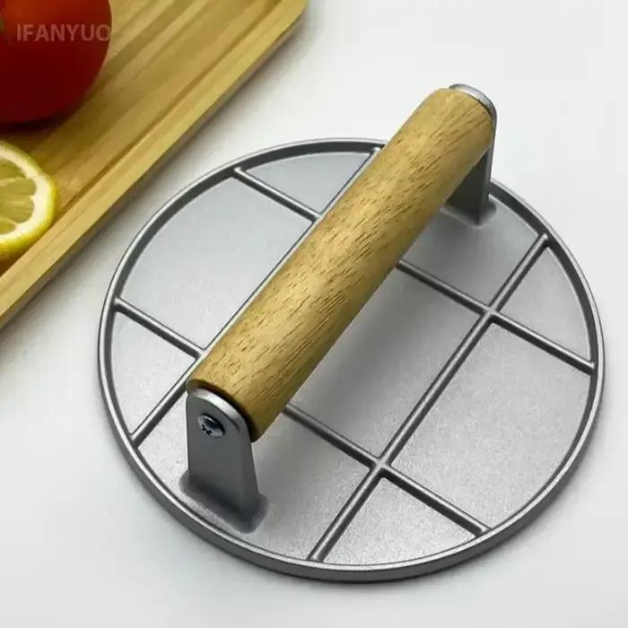 Presse à burger en fonte avec poignée en bois