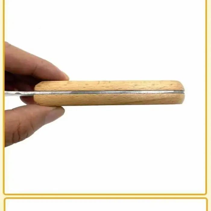 Râpe à noix de coco manuelle avec manche en bois
