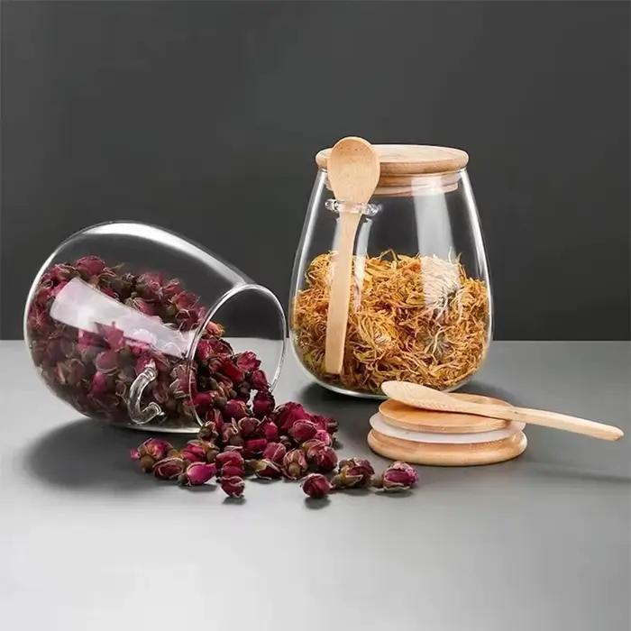 Pot en verre scellé à la mode avec cuillère et couvercle