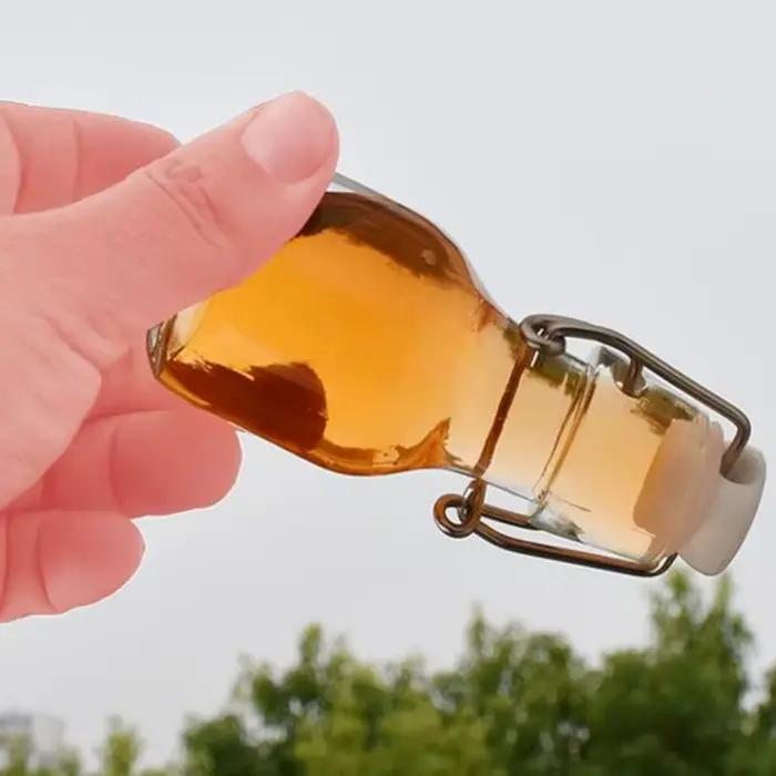 Mini bouteille de vinaigre en verre