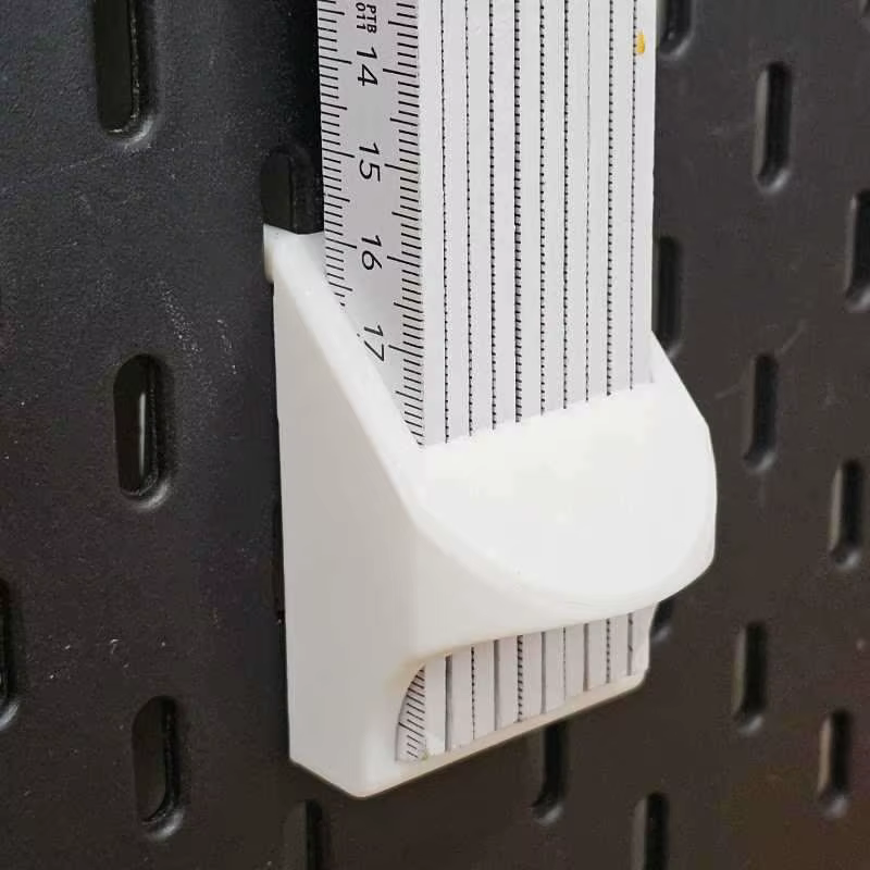 Support mural pliable Skadis pour règles et outils de mesure
